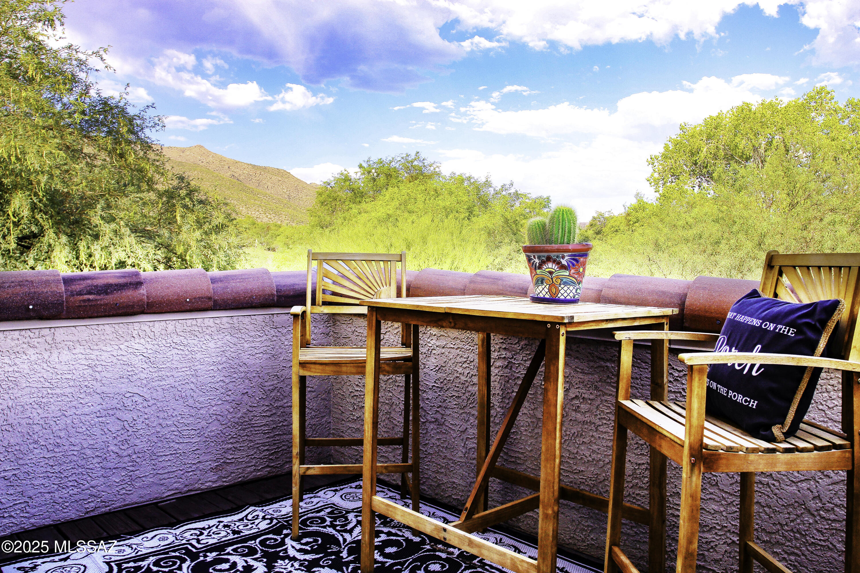 5202 Spring View Drive Tucson, AZ 85749 - Photo 30 of 49 a terrace of a house with table and chairs