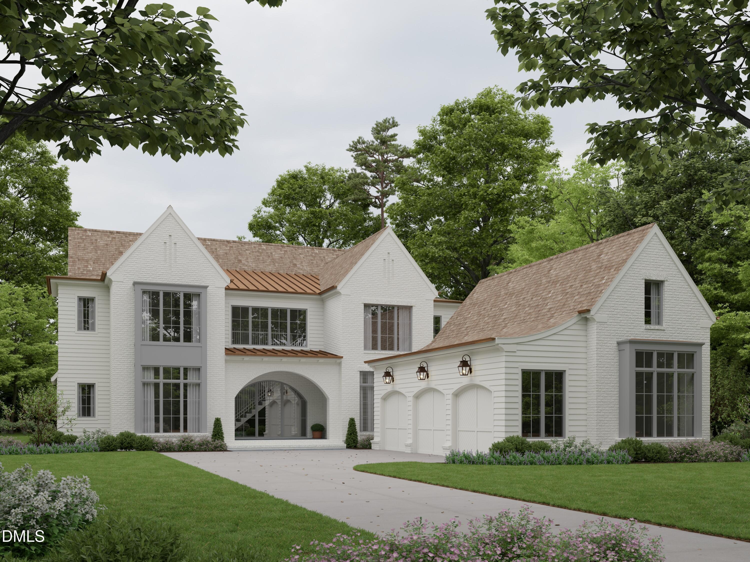 a front view of a house with a garden and plants
