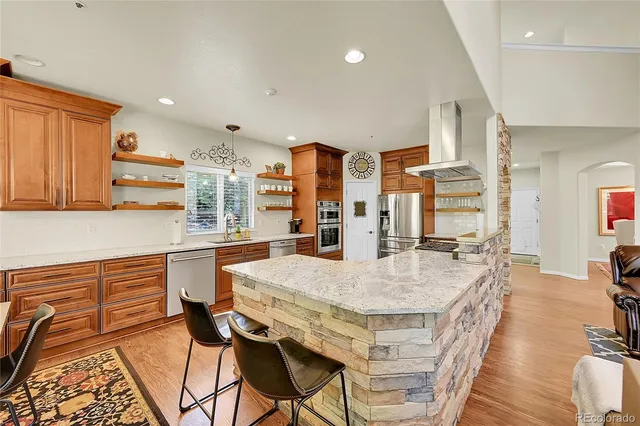 a large kitchen with a table and chairs