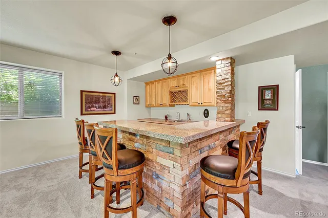 a view of a dining room with furniture and window