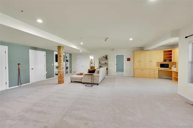a view of a livingroom with furniture and a flat screen tv