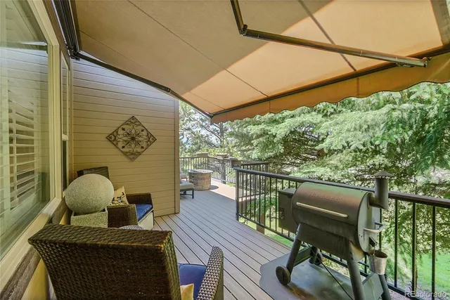 a view of balcony with furniture and wooden floor