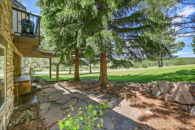 a view of a garden with a house