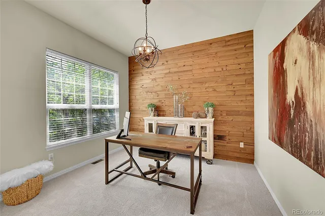 a work room with furniture and windows