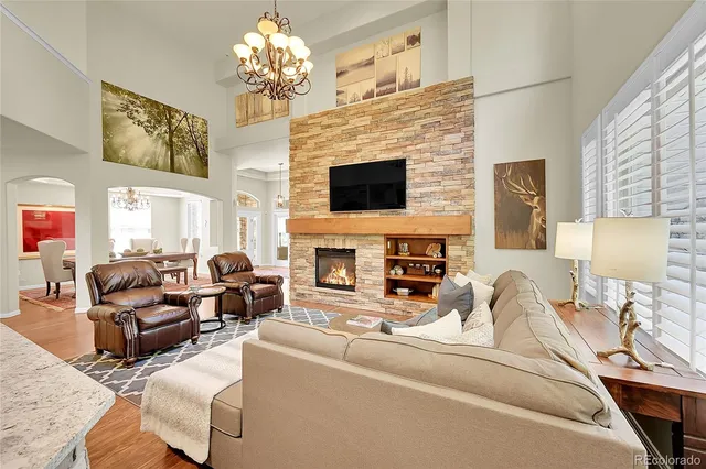 a living room with furniture fireplace and a flat screen tv