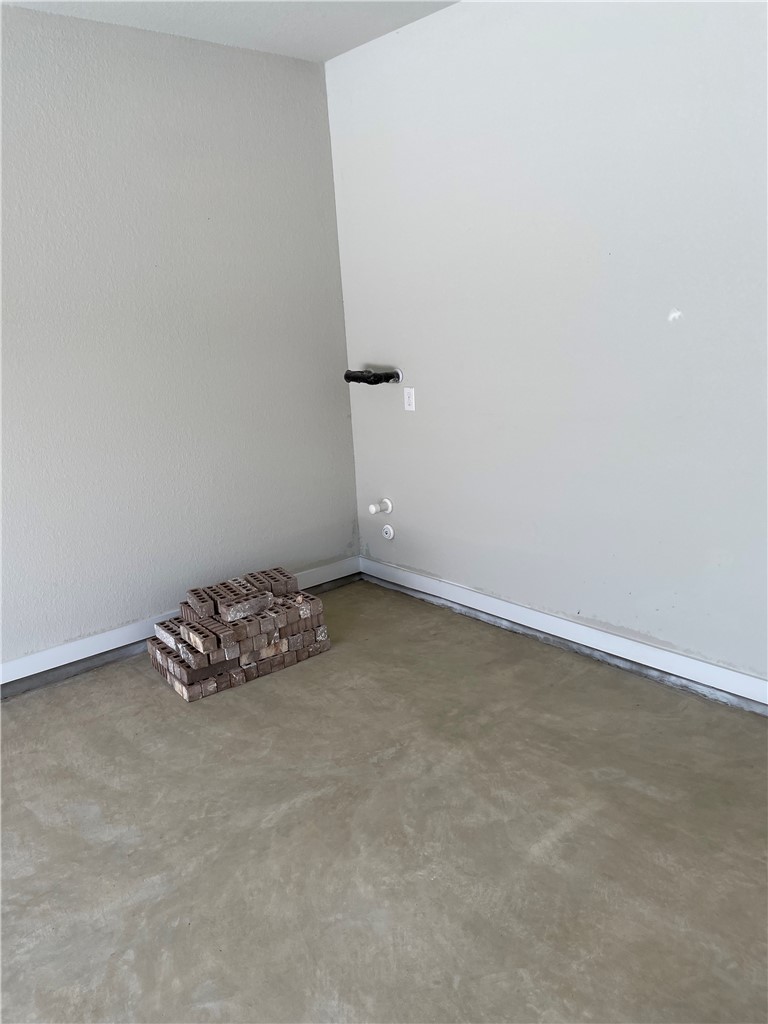 609 Paddock Lane Georgetown, TX 78626 - Photo 29 of 40 Smooth concrete flooring and clean neutral walls define this versatile utility space.