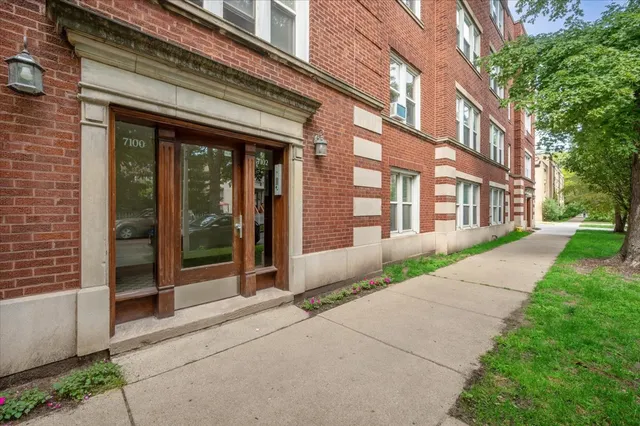 a view of a building with a yard