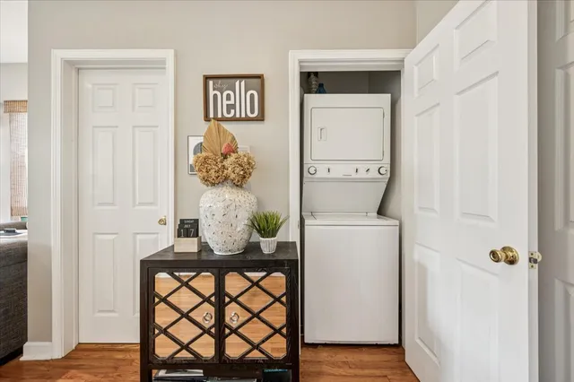 a room that has a dresser and a table in it
