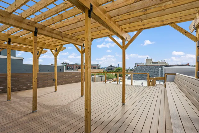 a view of a swimming pool with a outdoor seating
