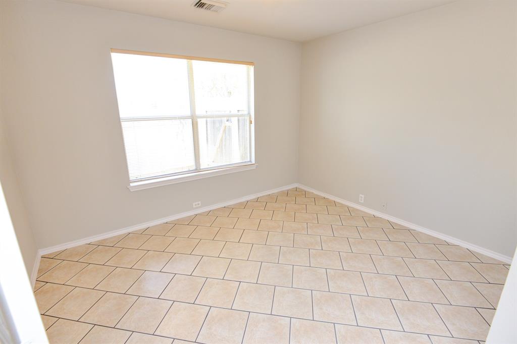 2109 Kimra Lane Cedar Park, TX 78613 - Photo 15 of 31 Spare room featuring baseboards and light tile patterned floors
