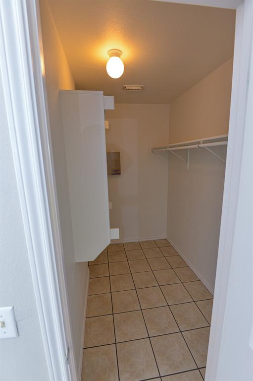 2109 Kimra Lane Cedar Park, TX 78613 - Photo 19 of 31 Spacious closet with light tile patterned floors
