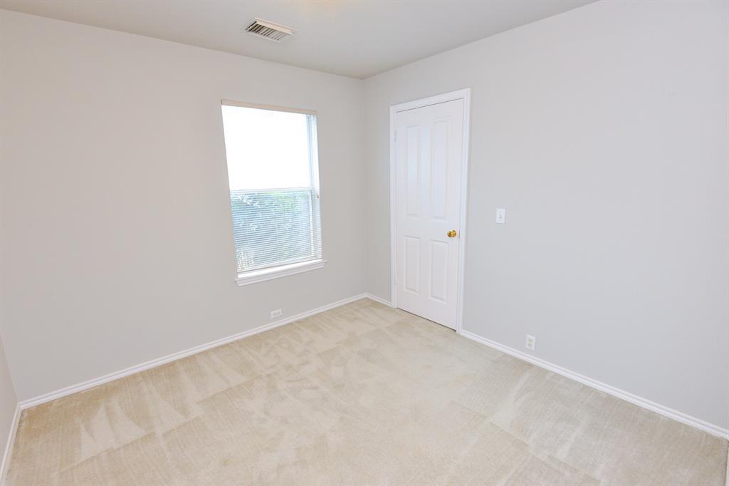 2109 Kimra Lane Cedar Park, TX 78613 - Photo 21 of 31 Empty room with light carpet and baseboards