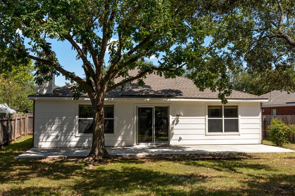 2109 Kimra Lane Cedar Park, TX 78613 - Photo 29 of 31 Back of property featuring a patio area and roof with shingles