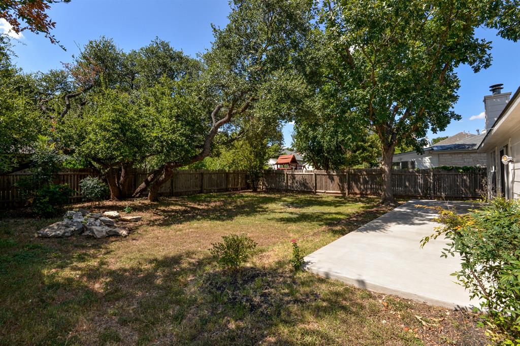 2109 Kimra Lane Cedar Park, TX 78613 - Photo 4 of 31 Fenced backyard featuring a patio