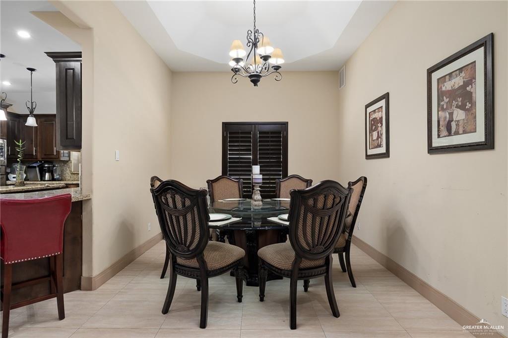 1609 Trinity Street Mission, TX 78572 - Photo 5 of 15 a view of a dining room with furniture and chandelier