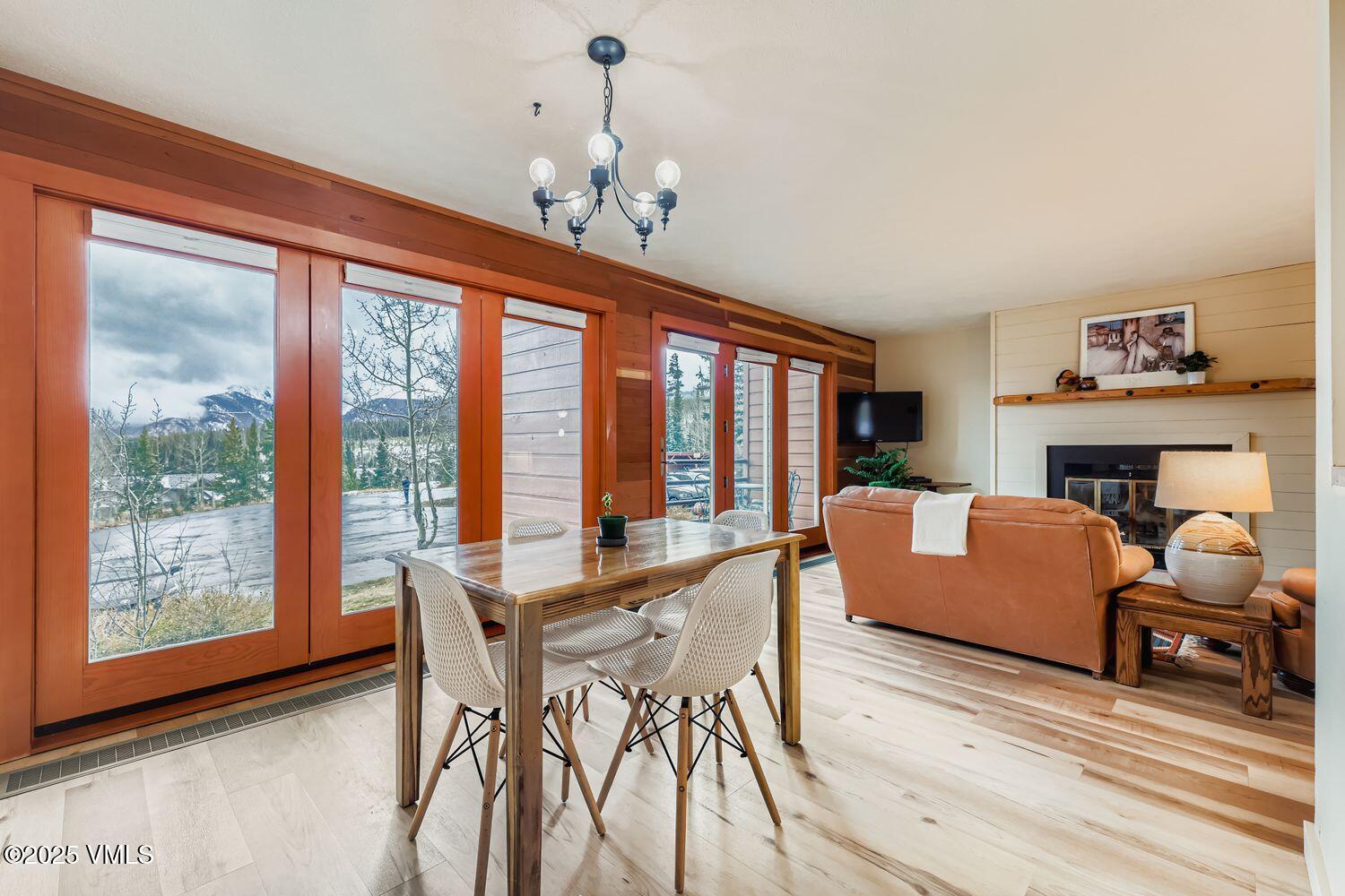 91300 Ryan Gulch Road, Unit 305 Silverthorne, CO 80498 - Photo 12 of 46 a living room with furniture and a large window