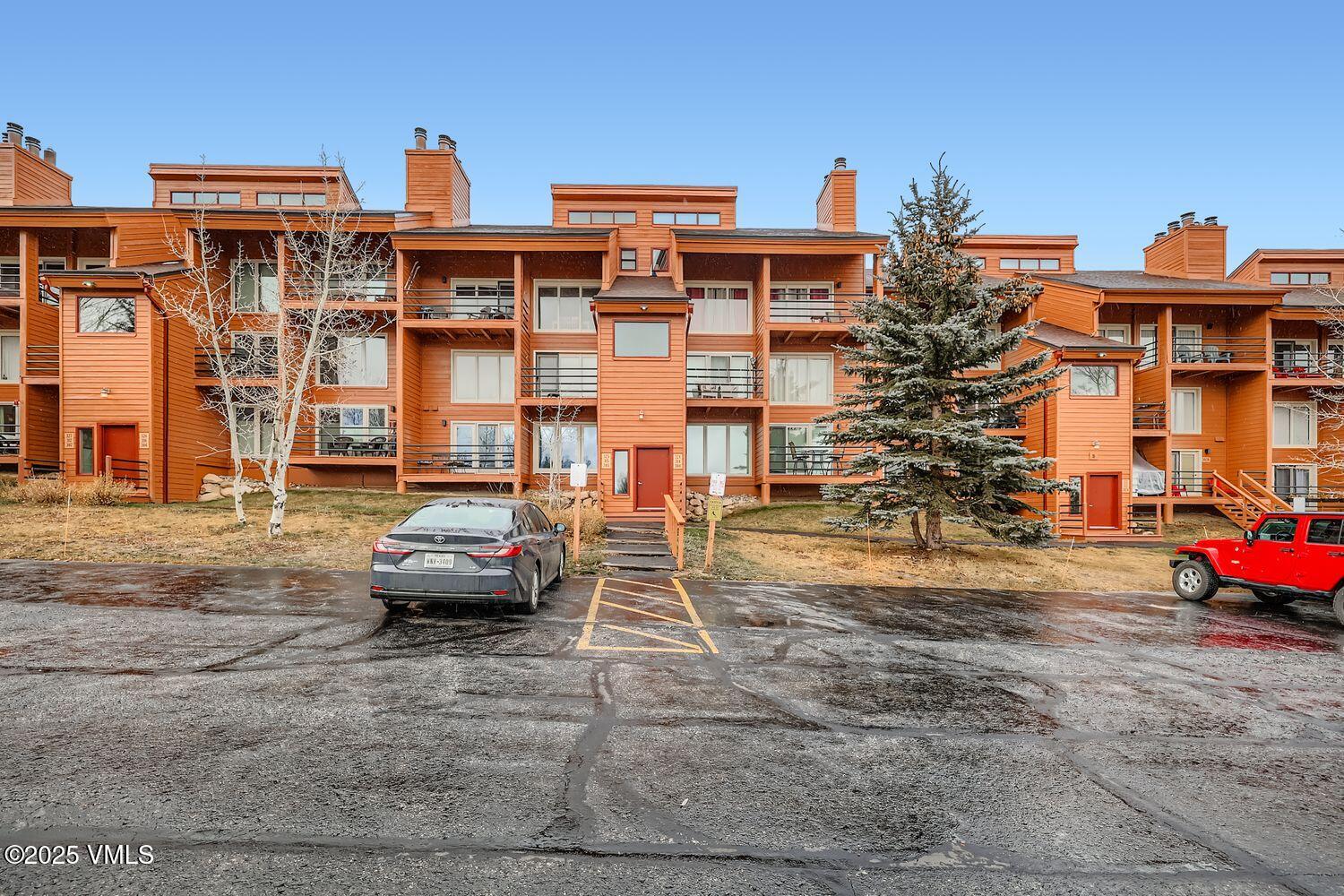 91300 Ryan Gulch Road, Unit 305 Silverthorne, CO 80498 - Photo 14 of 46 a car parked in front of a building