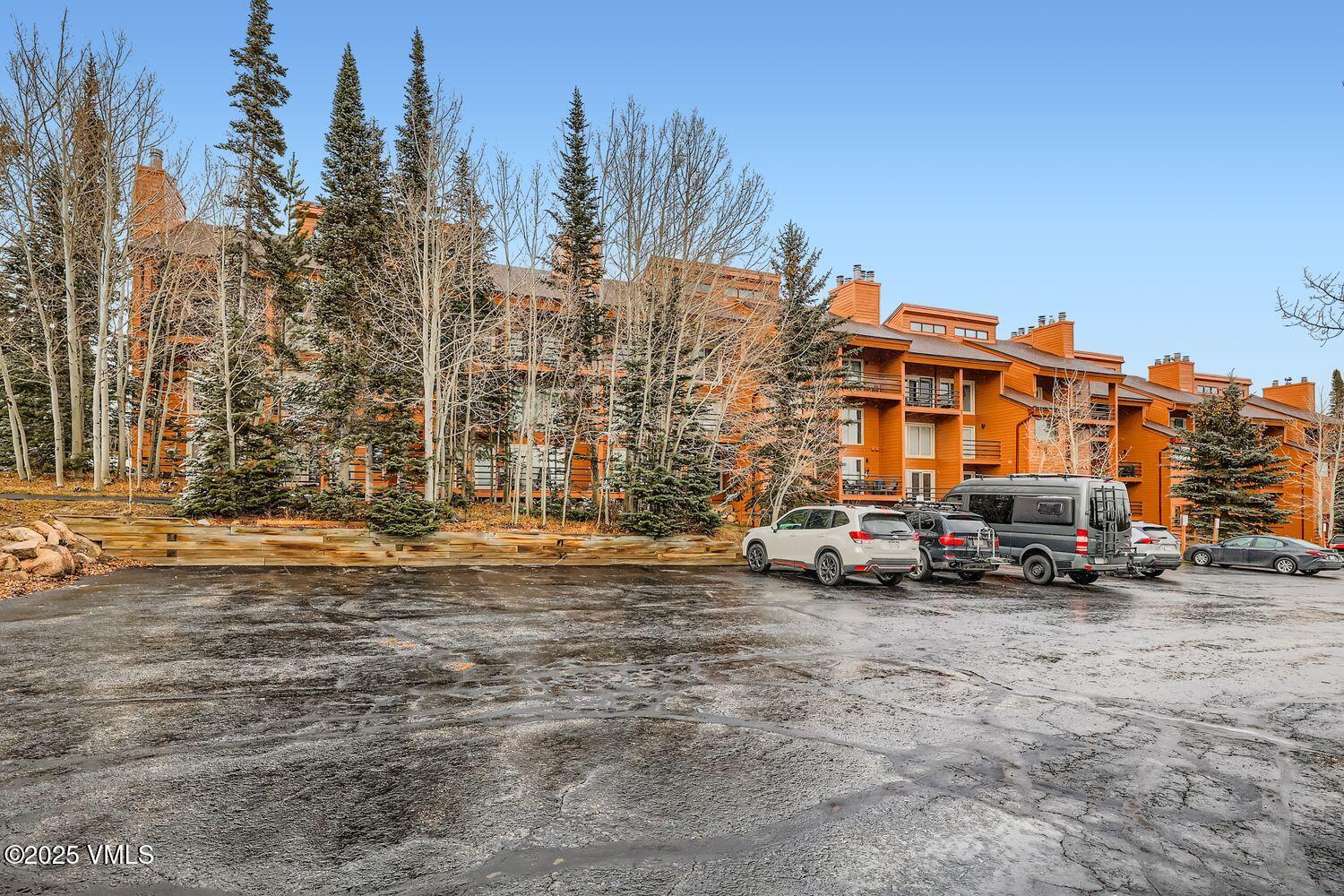 91300 Ryan Gulch Road, Unit 305 Silverthorne, CO 80498 - Photo 15 of 46 a view of street with parked cars