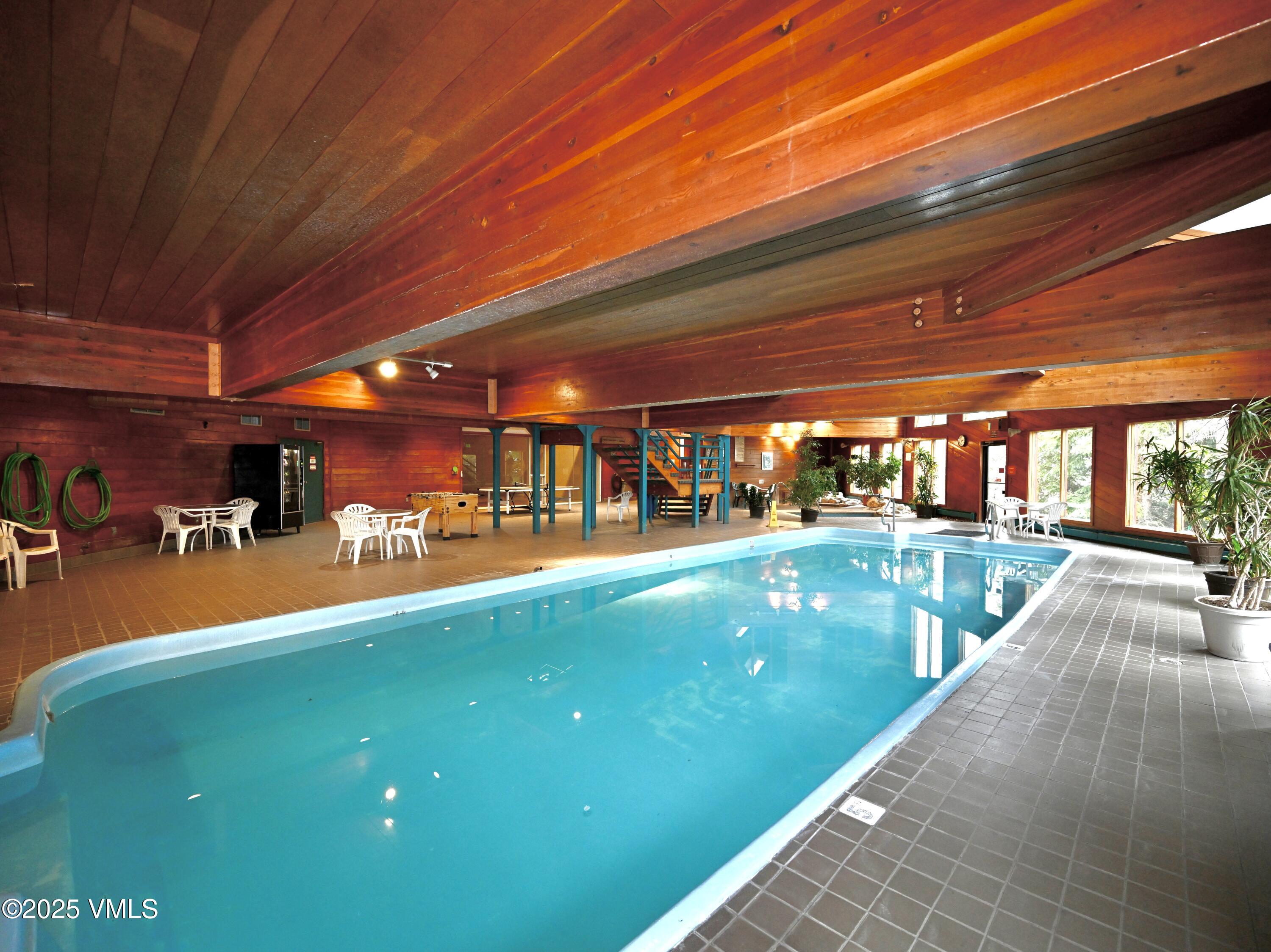 91300 Ryan Gulch Road, Unit 305 Silverthorne, CO 80498 - Photo 17 of 46 a view of a swimming pool with a patio