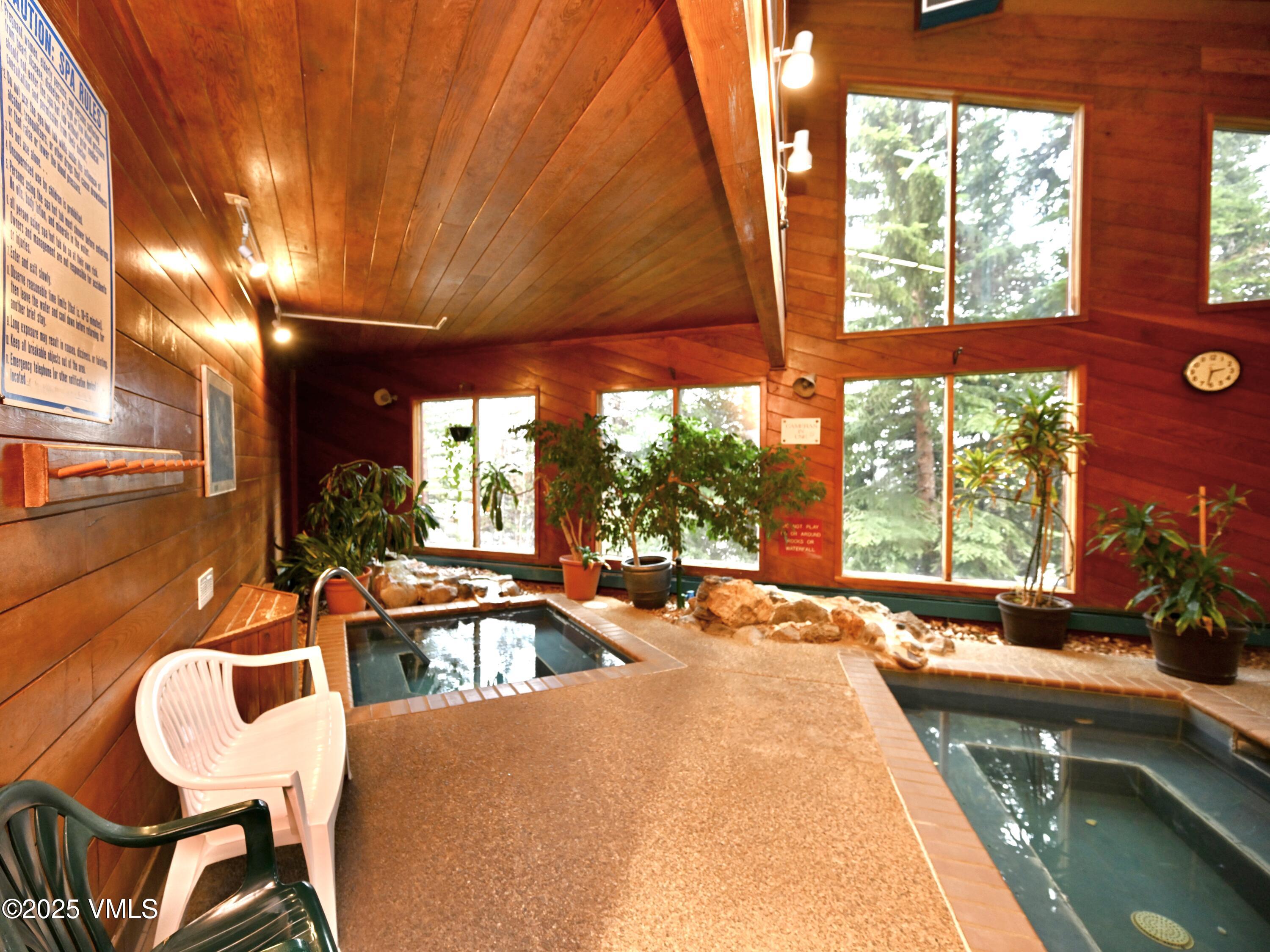 91300 Ryan Gulch Road, Unit 305 Silverthorne, CO 80498 - Photo 18 of 46 a outdoor space with lounge chair and windows