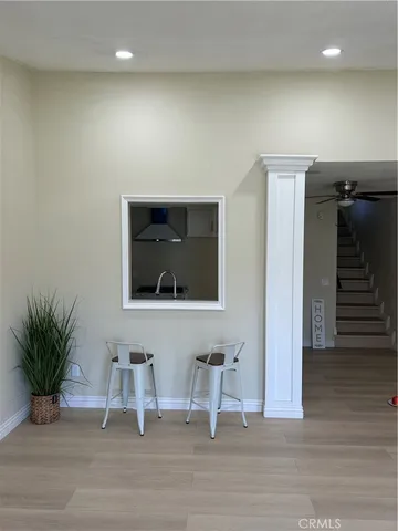 a view of a livingroom with a chair and table