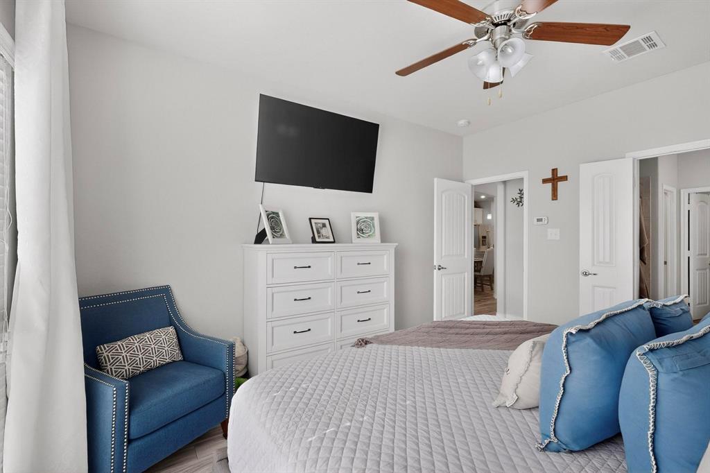 9801 Diamondback McKinney, TX 75071 - Photo 17 of 40 Bedroom with wood finished floors and a ceiling fan