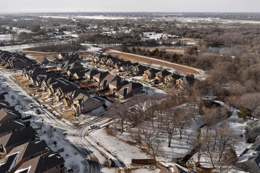 9801 Diamondback McKinney, TX 75071 - Photo 36 of 40 Snowy aerial view featuring a residential view