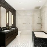 a bathroom with a double vanity sink a toilet and a shower