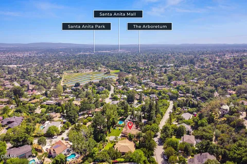 an aerial view of a house with a yard