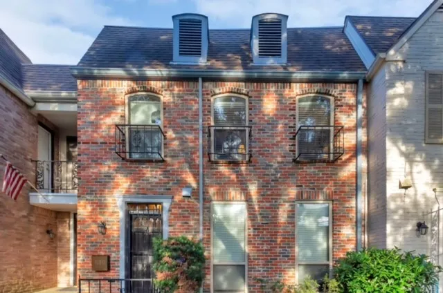 a front view of a building with glass windows