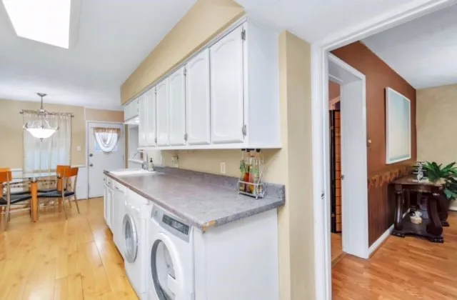 a view of a kitchen with furniture and staircase