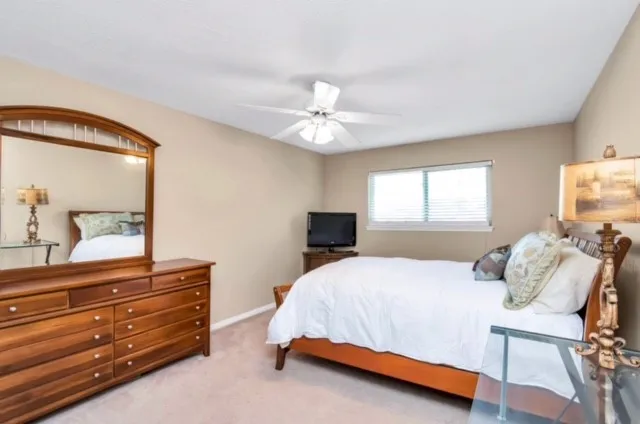 a bedroom with a bed and a dresser
