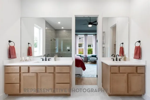 a bathroom with a sink double vanity and a mirror