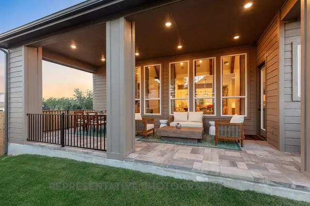 a living room with furniture a window and a table