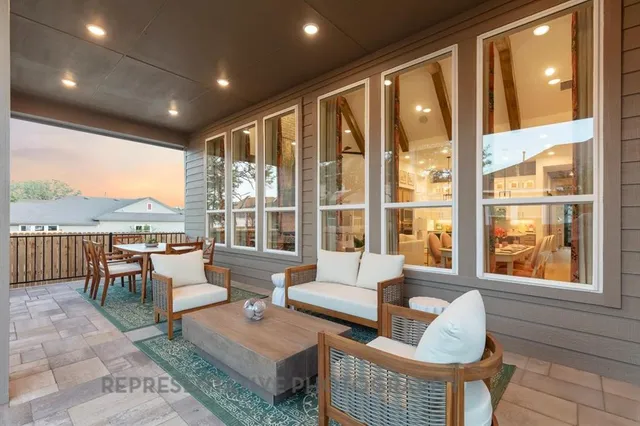 a view of an outdoor dining space with a patio