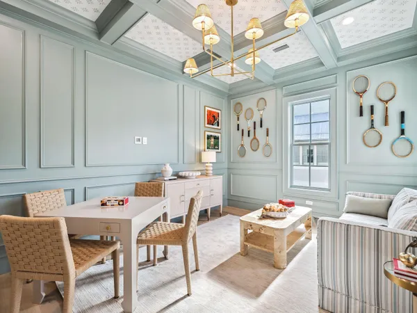 a dining room with furniture and wooden floor