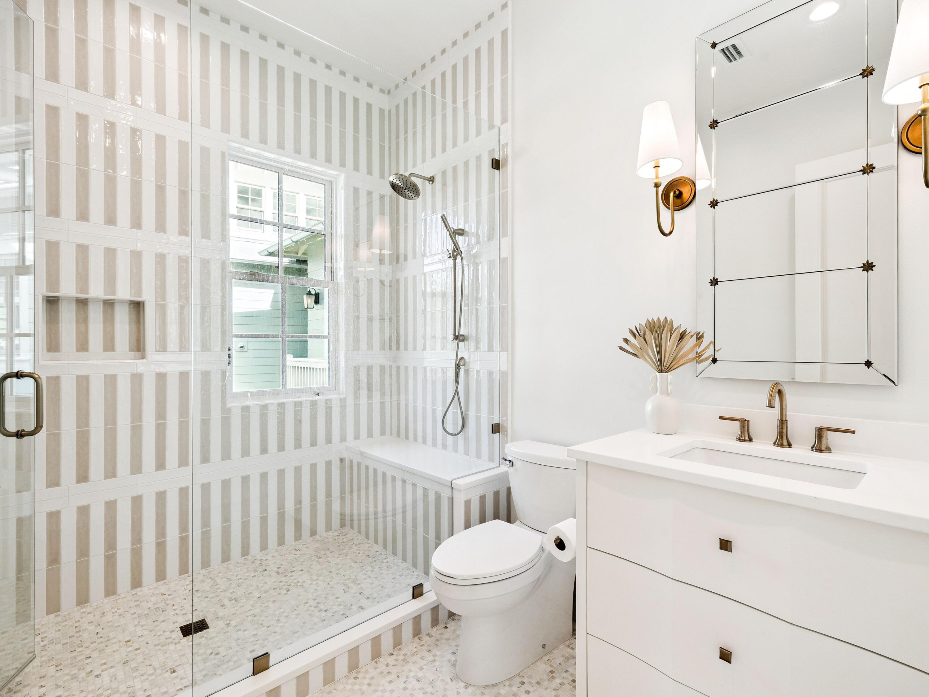 34 Climbing Rose Way Santa Rosa Beach, FL 32459 - Photo 21 of 34 a bathroom with a sink toilet a shower and a mirror
