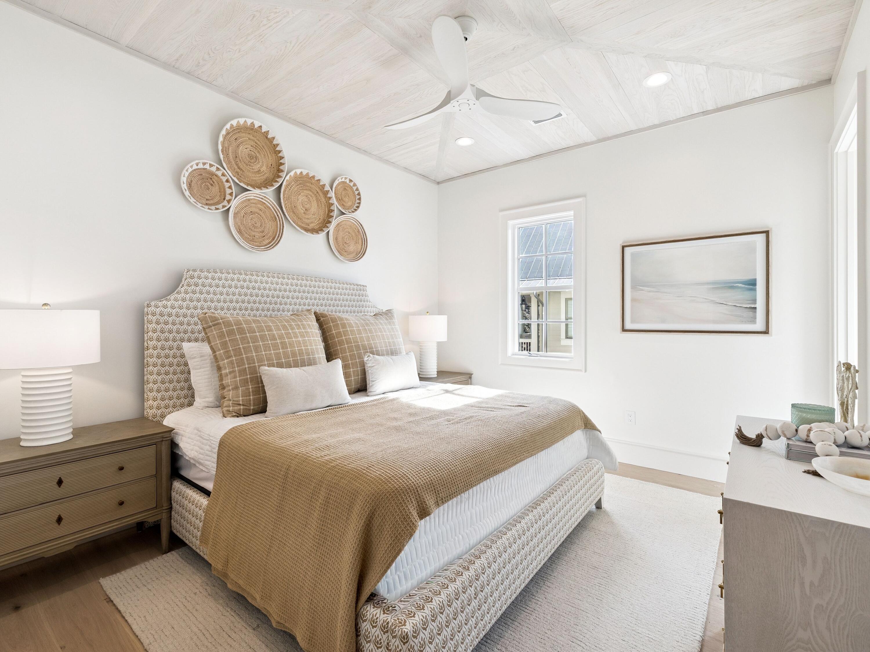 34 Climbing Rose Way Santa Rosa Beach, FL 32459 - Photo 22 of 34 a bedroom with a bed and a lamp on dresser