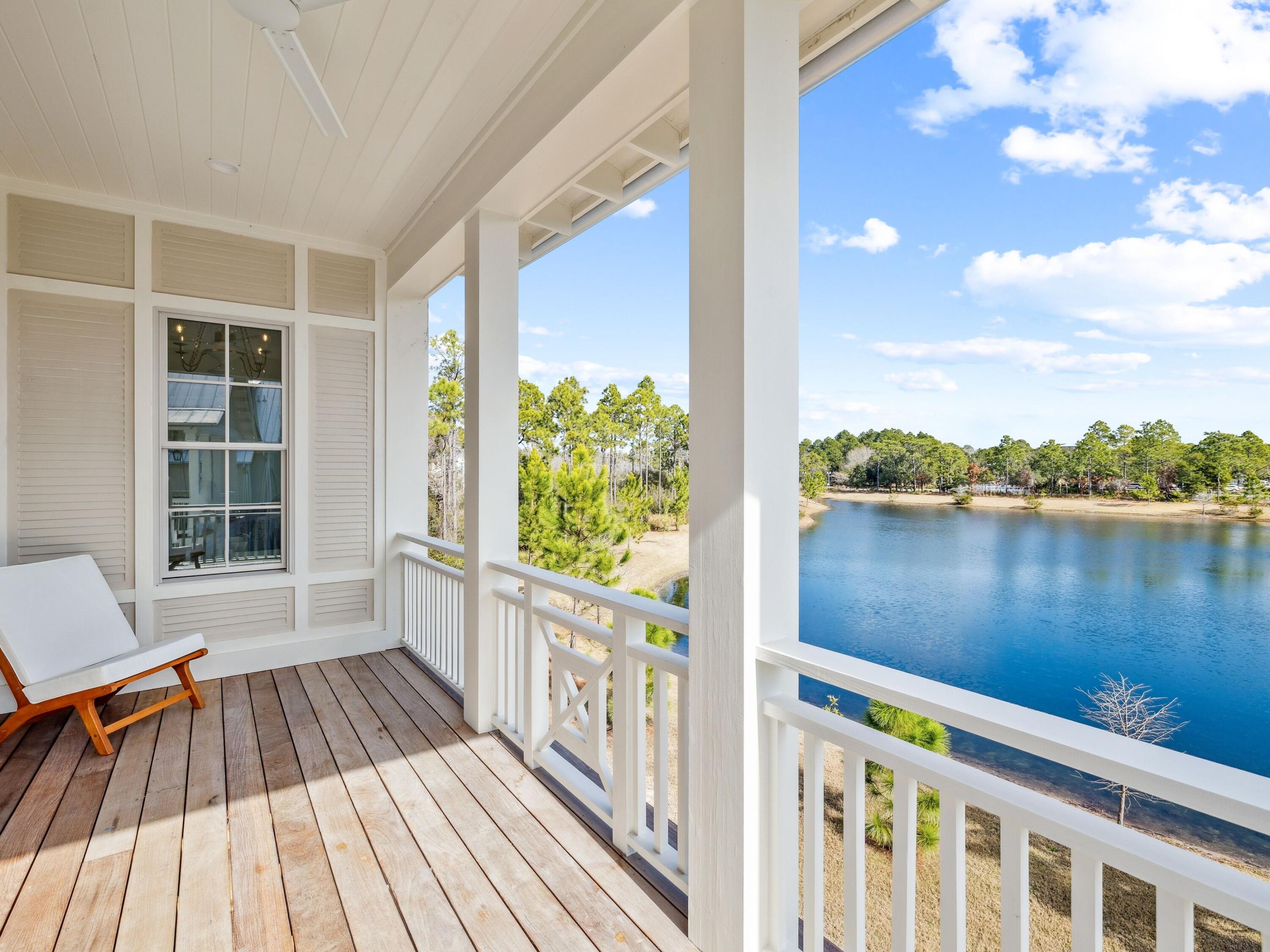 34 Climbing Rose Way Santa Rosa Beach, FL 32459 - Photo 7 of 34 a view of a balcony with lake view and wooden floor