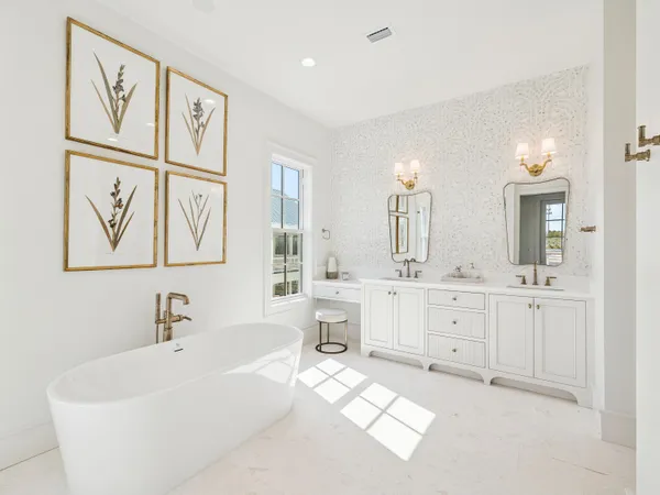 a bathroom with a double vanity sink mirror and