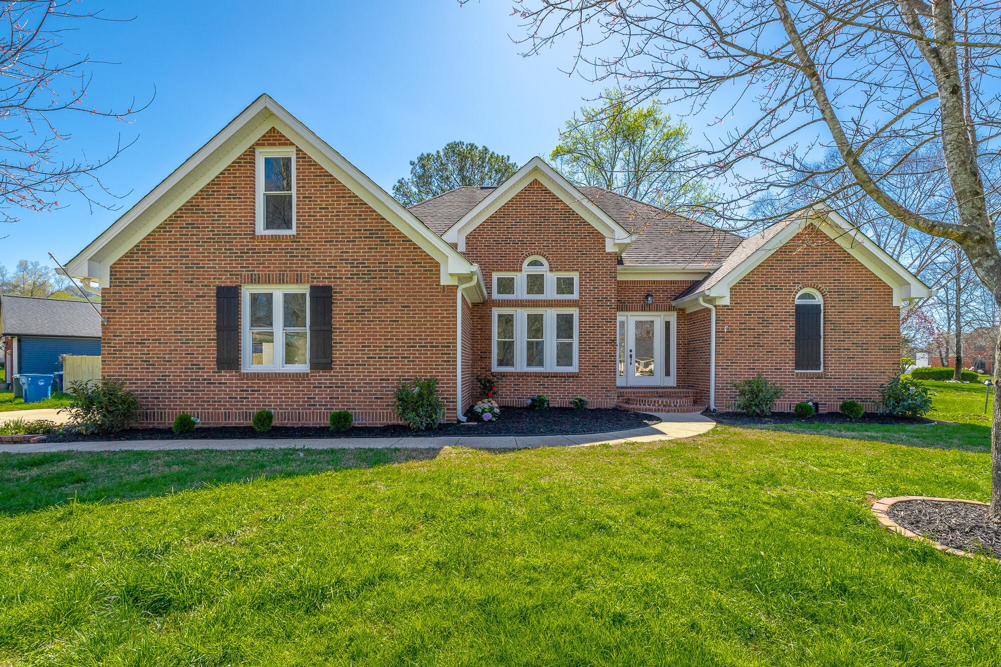 1618 Gunston Hall Road Hixson, TN 37343 - Photo 3 of 25 a front view of a house with a yard
