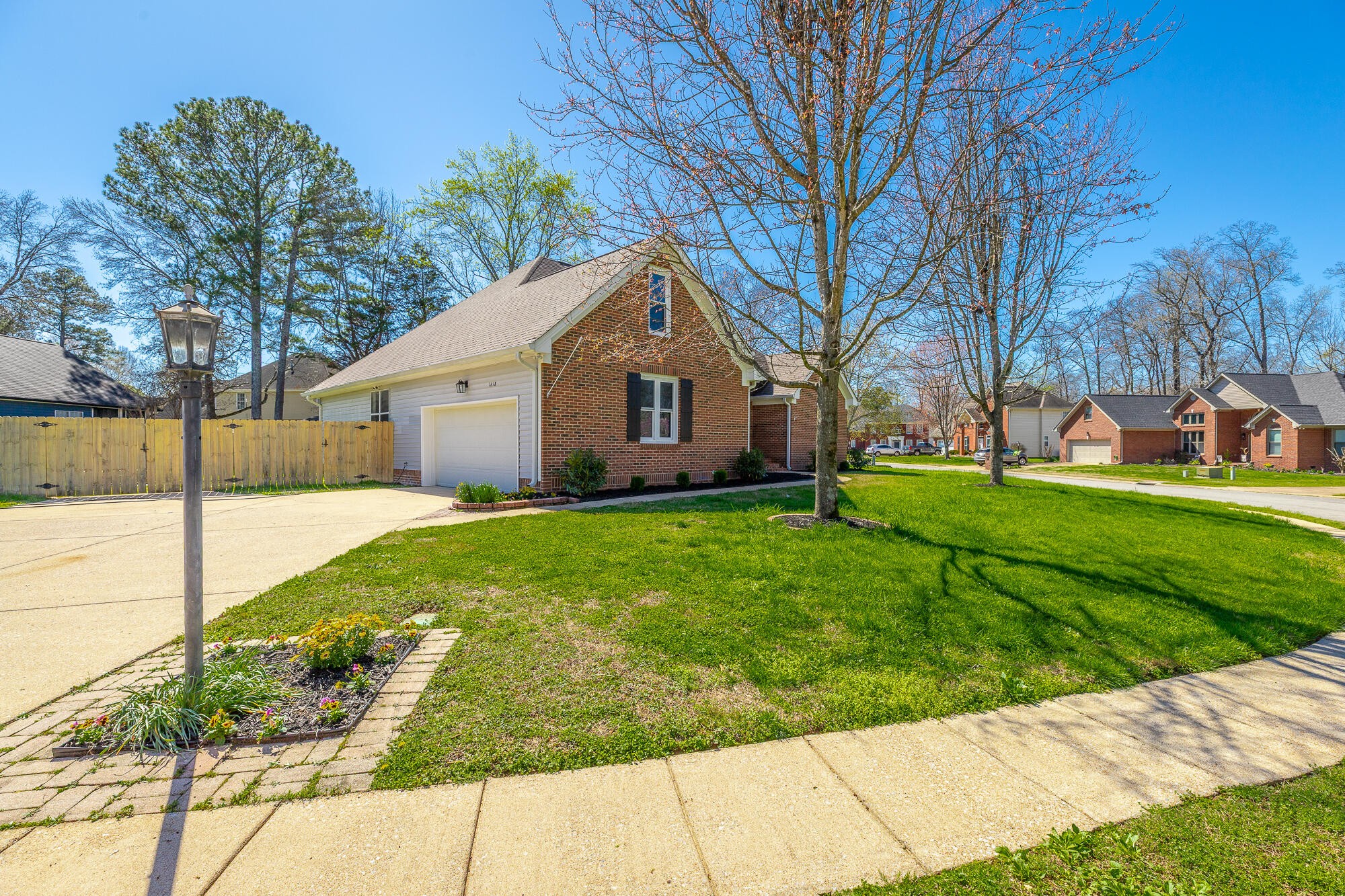 1618 Gunston Hall Road Hixson, TN 37343 - Photo 6 of 25 a front view of house with yard and green space