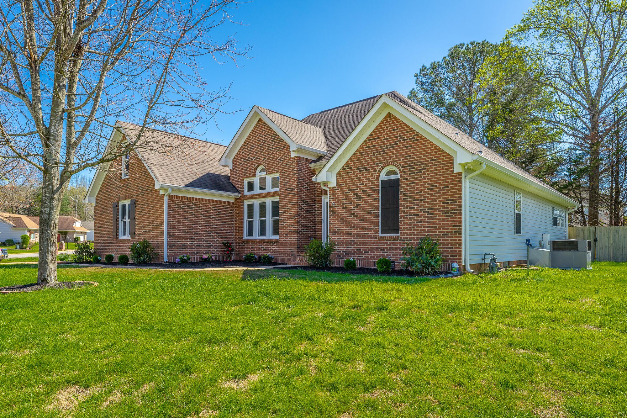 1618 Gunston Hall Road Hixson, TN 37343 - Photo 9 of 25 a front view of a house with a yard and garage