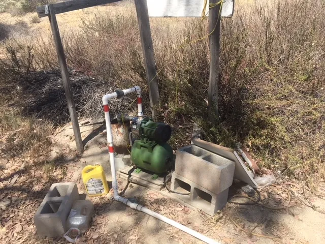a view of a backyard with chair and table