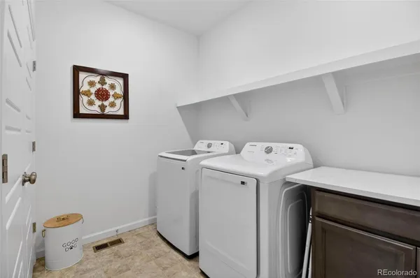 a utility room with dryer and washer