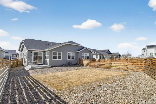 a view of a house with a yard and sitting space