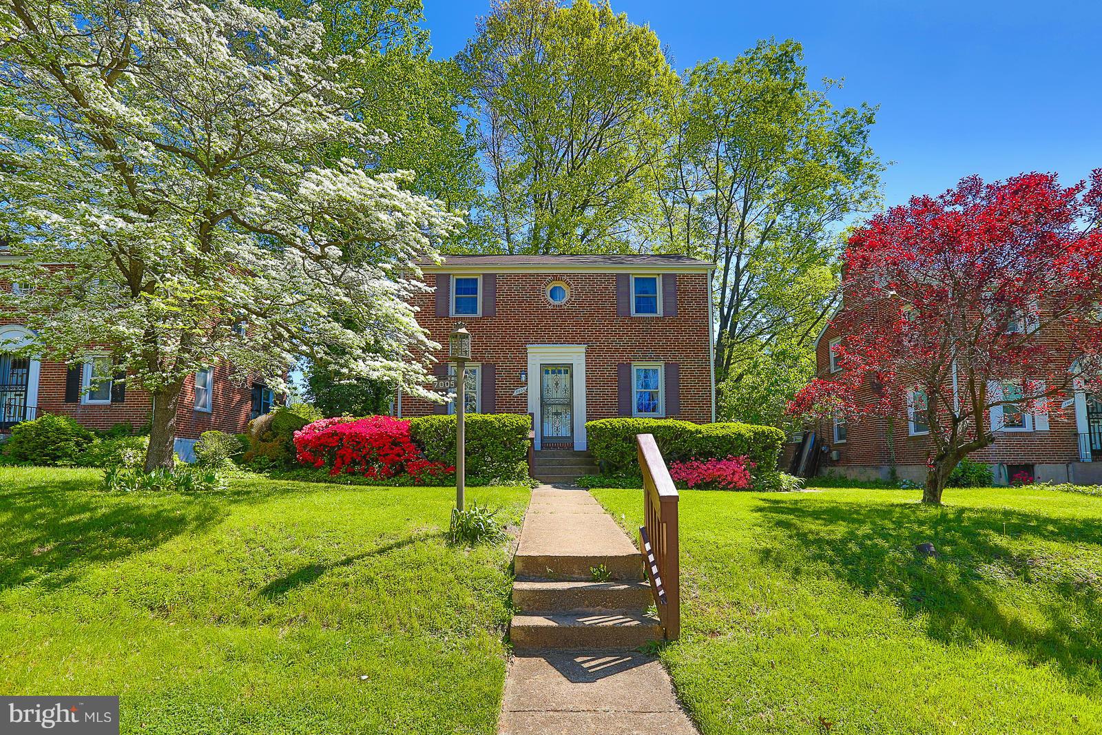 7005 Deerfield Road Pikesville, MD 21208 - Photo 2 of 30 pretty front lawn flowering dogwood
