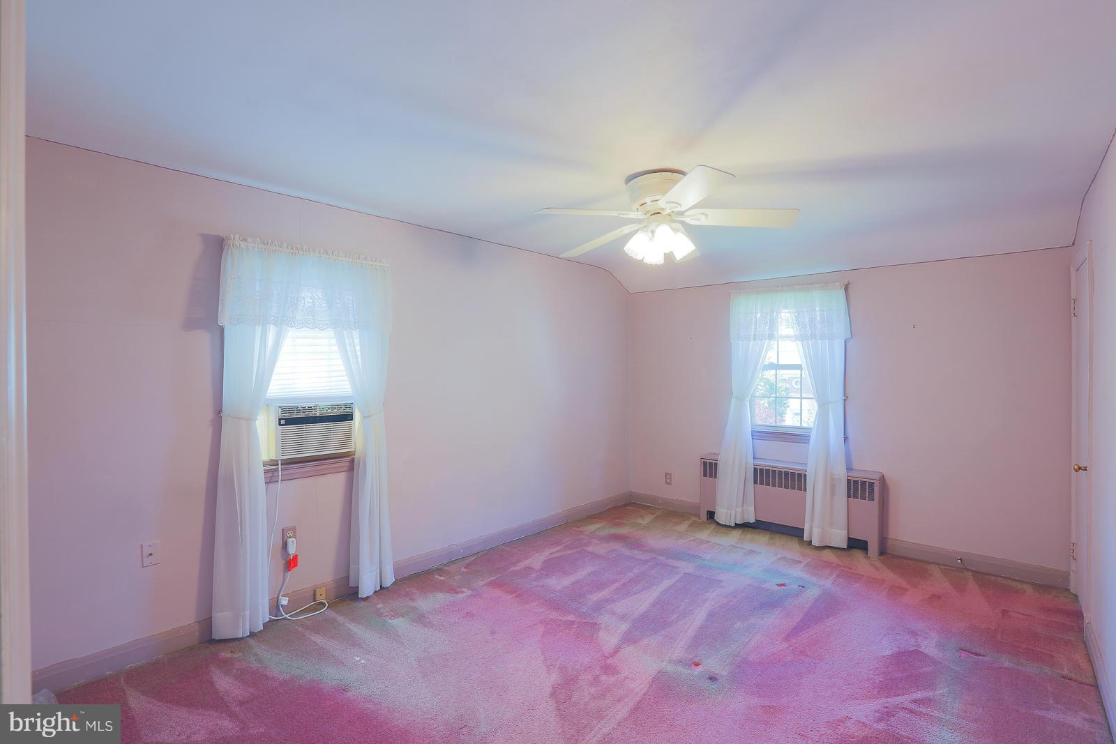 7005 Deerfield Road Pikesville, MD 21208 - Photo 16 of 30 Bedroom upstairs.
