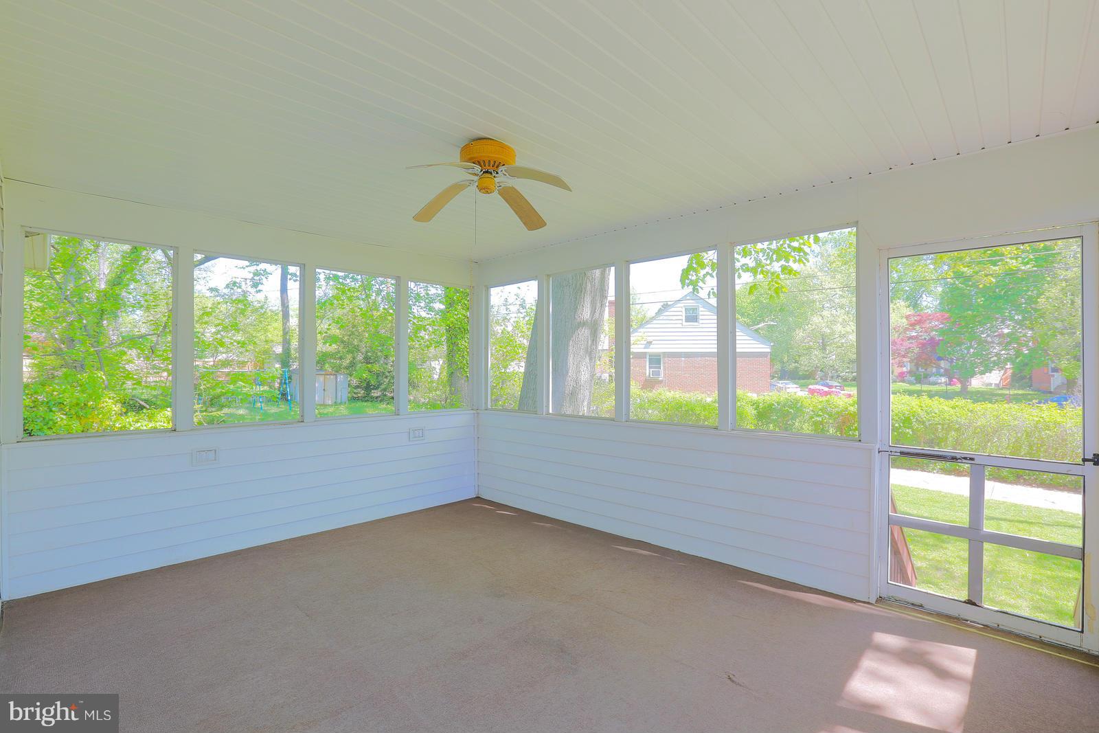 7005 Deerfield Road Pikesville, MD 21208 - Photo 17 of 30 Screened porch with ceiling fan.