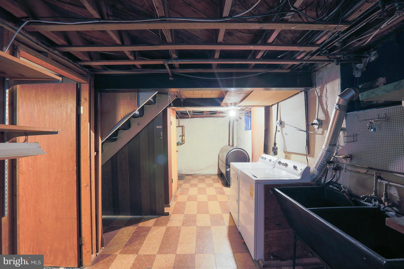 7005 Deerfield Road Pikesville, MD 21208 - Photo 22 of 30 Basement with laundry and storage.